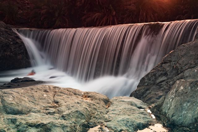 Long exposure of a wide waterfall over a dam lip