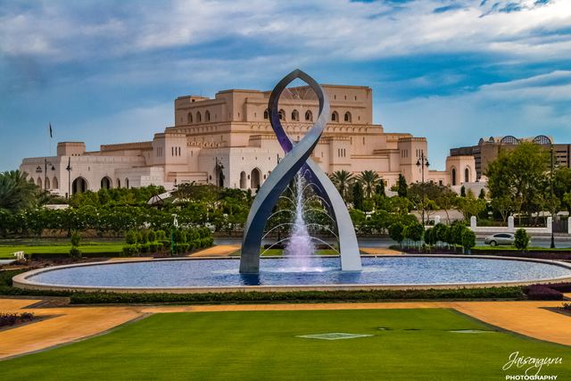Opera house and fountain sculpture in the afternoon light